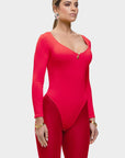 Woman wearing a red bodysuit on a white background