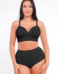 Woman wearing a black bikini set on a white background