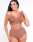 Woman wearing a brown bra and panties set on a white background