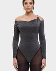 Woman wearing a black off-shoulder bodysuit on a white background