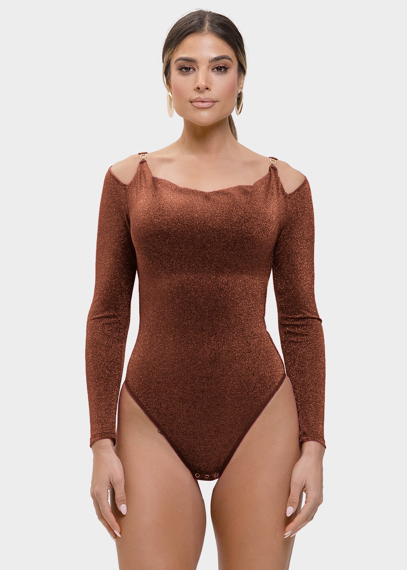 Woman wearing a brown bodysuit on a white background