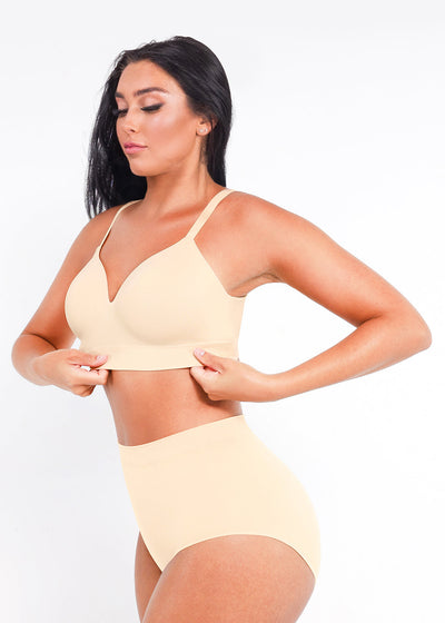 Woman wearing a yellow bikini set against a plain background