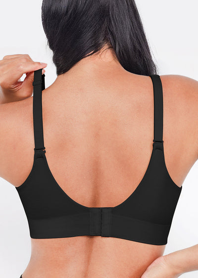 Black bra worn by a person on a white background