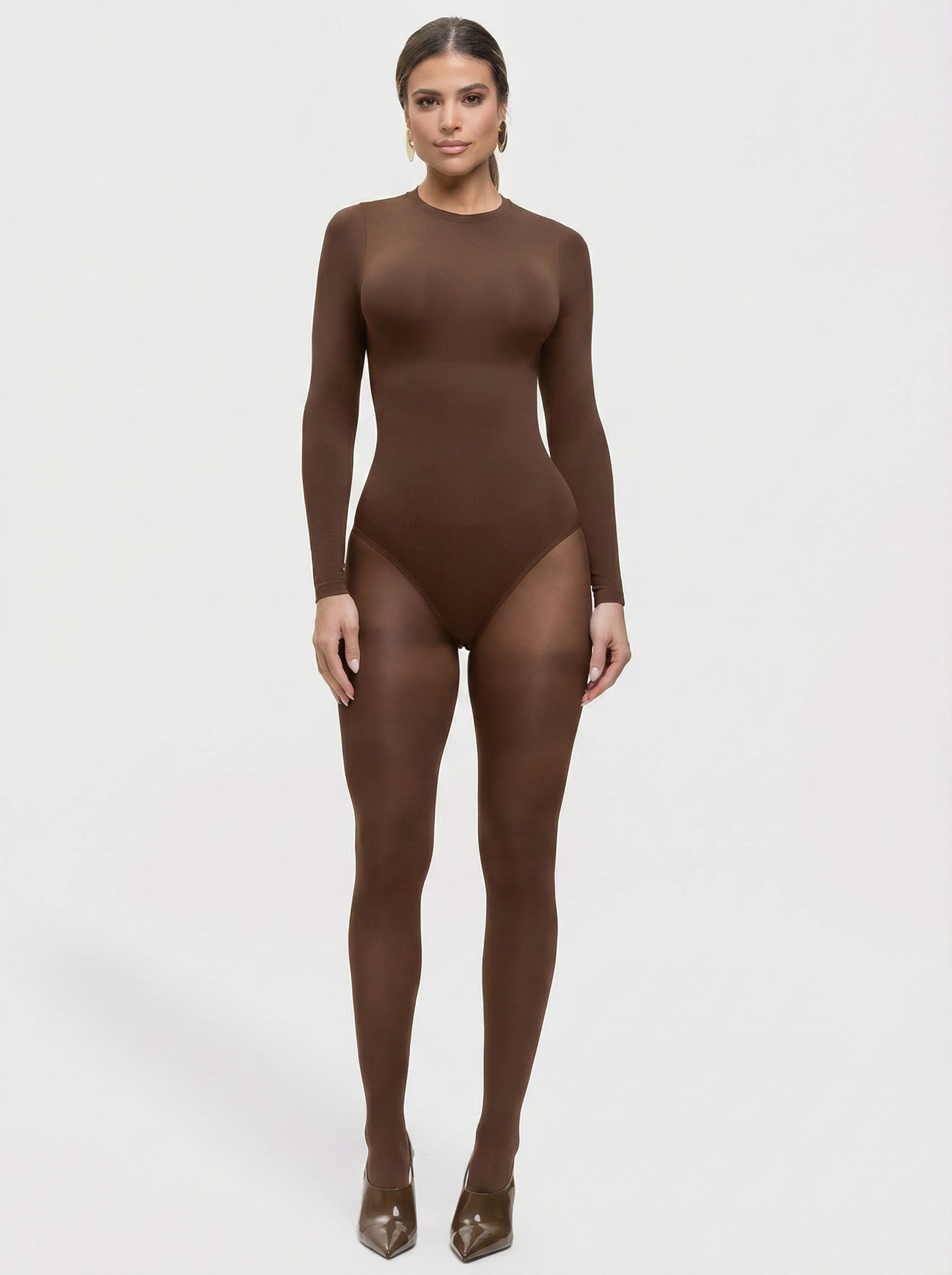 Person wearing a brown bodysuit on a white background