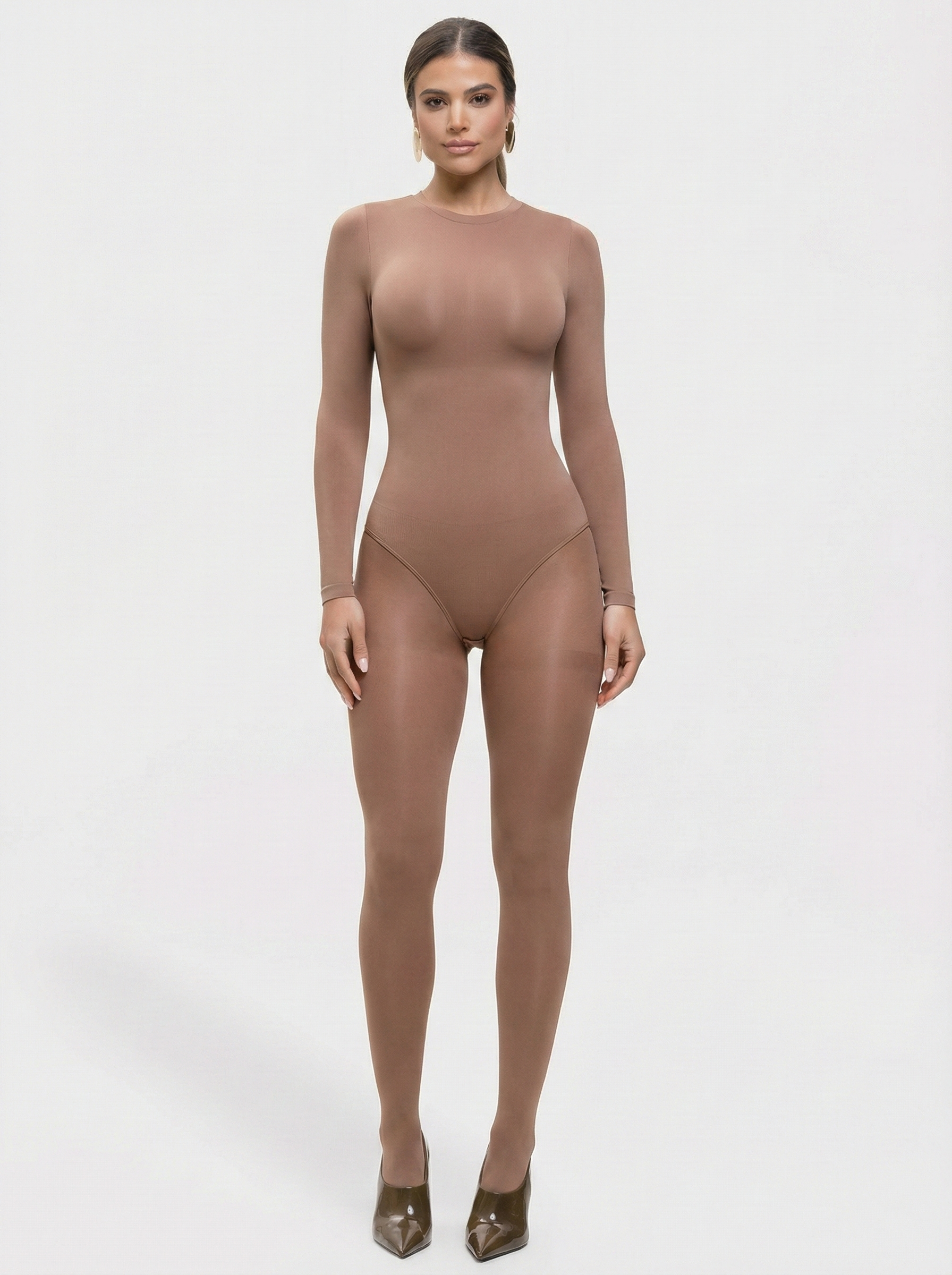 Woman wearing a brown bodysuit on a white background