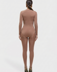 Brown bodysuit worn by a model on a white background
