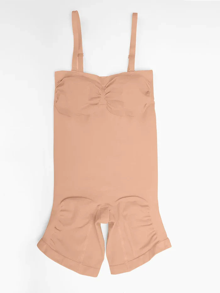 Beige romper with suspenders on a white background